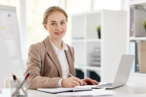 female accountant working on her personal website