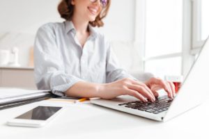 developer working on laptop, coding a website